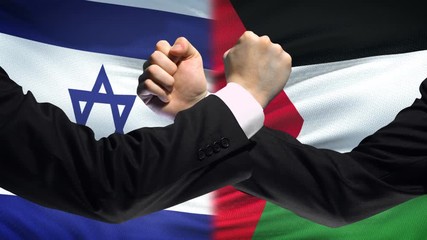 Israel vs Palestine confrontation, religious conflict, fists on flag background