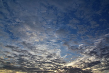 Naklejka na ściany i meble Sunset with beautiful blue sky. Atmospheric background