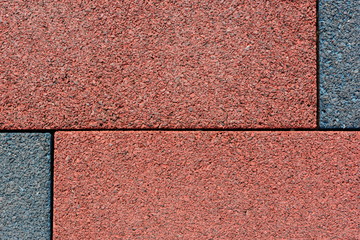 Tile of rubber crumbs on the playground.