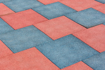 Tile of rubber crumbs on the playground. Square shape