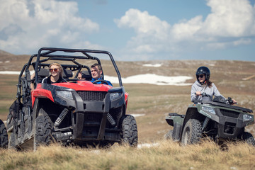 Friends driving off-road with quad bike or ATV and UTV vehicles © FS-Stock
