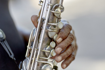 Fototapeta premium Man's hands playing a Saxophone