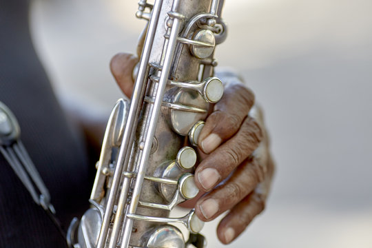 Man's hands playing a Saxophone