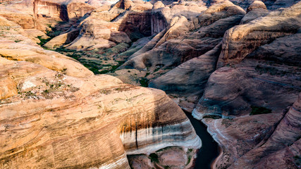 Aerial view of Lake Powell near Navjo Mountain, San Juan River in Glen Canyon with colorful buttes, skies and water