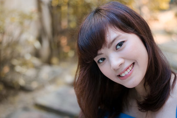 Close up of young pretty Asian woman in the garden.
