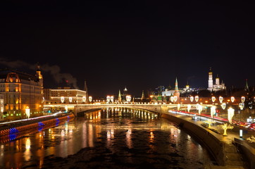 Fototapeta na wymiar Evening view of the Moscow Kremlin and Big Moskvoretsky bridge with new year illumination, Moscow, Russia