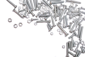 Collection Of Iron Screws, Wood Screws and Bolts At The Right and Top Border Of A Whitebox