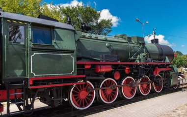 Fototapeta na wymiar Vintage locomotive with steam engine