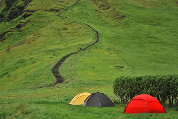 Tent camp at the foot of the Icelandic waterfall Skogafoss