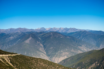 Obraz premium Beautiful mountain view with blue sky at Yading national reserve at Daocheng County, in the southwest of Sichuan Province, China.