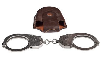 Obraz premium real police handcuffs with case, isolated on white background