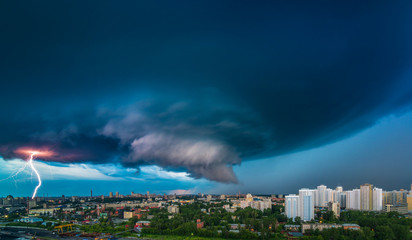 Thunderstorm in the city downtown at summer evening