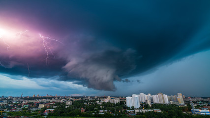 Thunderstorm in the city downtown at summer evening