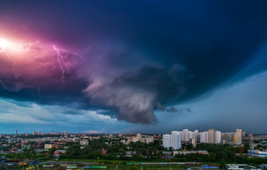 Thunderstorm in the city downtown at summer evening