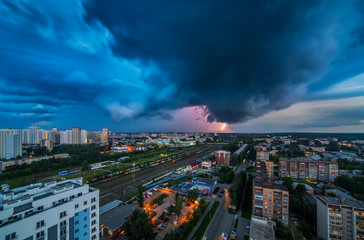 Thunderstorm in the city downtown at summer evening