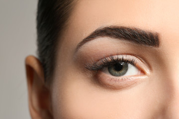 Young woman with permanent eyebrows makeup, closeup