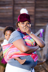 Black mother with a surprised look on her face