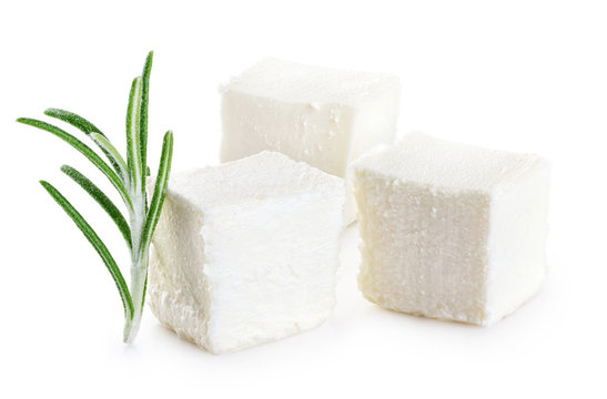 Feta cheese and rosemary isolated on white background.