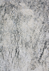 Old stucco wall texture of light gray color