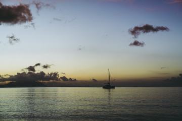 boat in the ocean at sunset 