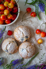 Tasty cupcakes on a white table. Cupcakes with sweet berries.