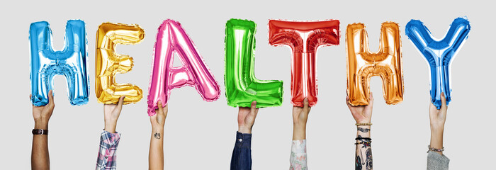Hands showing healthy balloons word