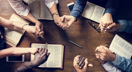Group of people holding hands praying worship believe - obrazy, fototapety, plakaty