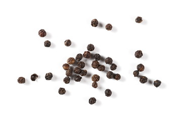 Black pepper pile, peppercorn isolated on white background, top view