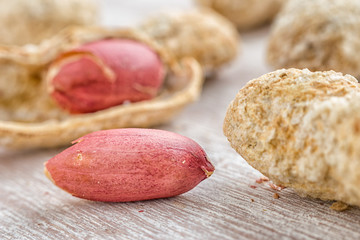 Peanut seen from close up on a wooden table.