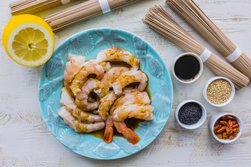 Giant prawns prepared for teriyaki with soba noodles.
