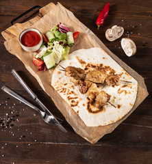 chicken kebab with salad