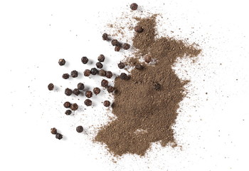 Black ground pepper powder pile with grains, peppercorn isolated on white background, top view