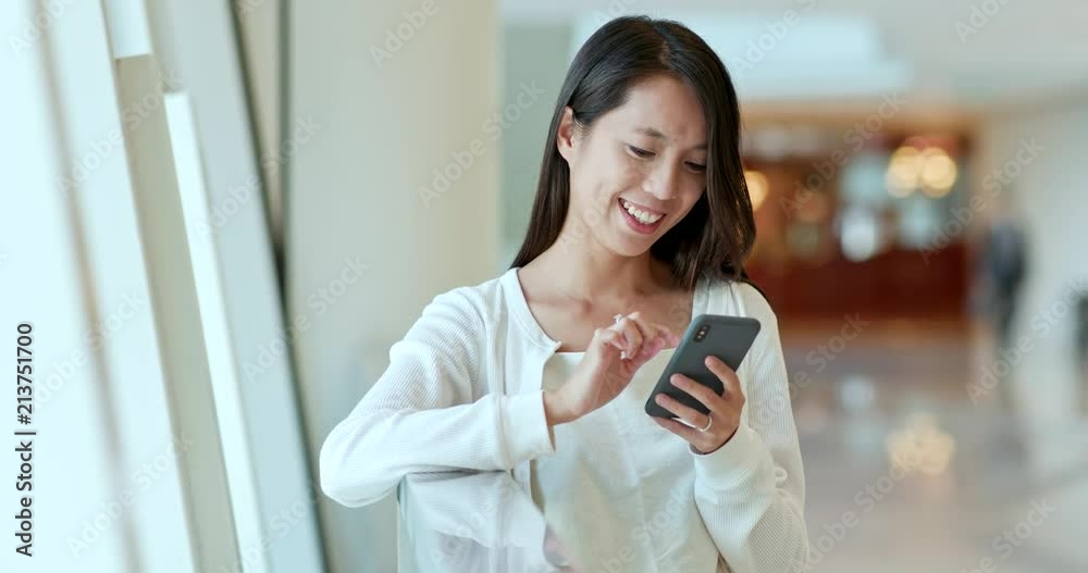 Canvas Prints Woman use of mobile phone for online inside shopping mall