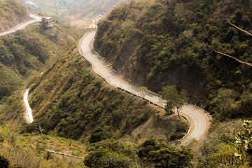 	One side of a mountain road with multiple view on the way to ranuka
