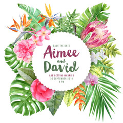 Wedding invitation on round paper emblem over tropical leaves and flowers