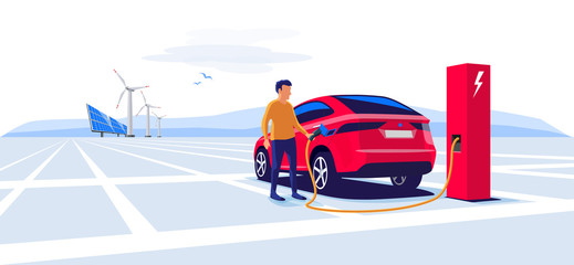 Naklejka premium Nowoczesny samochód elektryczny suv ładujący się na stacji ładującej z młodym mężczyzną trzymającym kabel. Turbiny wiatrowe i panele słoneczne w tle. Koncepcja ilustracji wektorowych płaski elektromobilność e-motion.