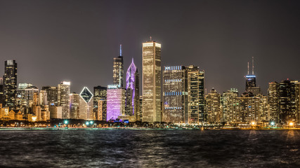 Chicago city skyline at night with bright lights