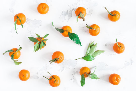Tangerines on white background. Flat lay, top view
