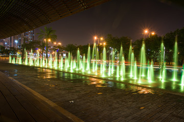 Fountain colored water show. Colorful fontain light in city