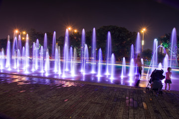 Obraz premium Fountain colored water show. Colorful fontain light in city