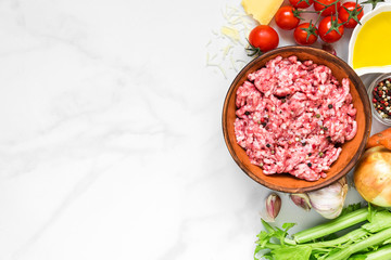 ingredients for cooking sauce bolognese over white marble table. cooking food concept. top view