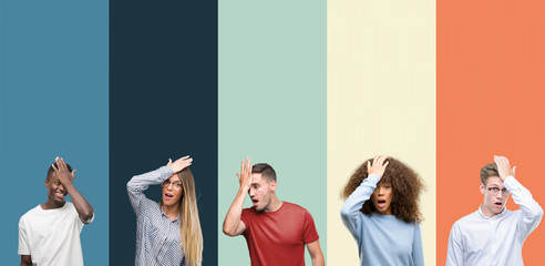 Group of people over vintage colors background surprised with hand on head for mistake, remember error. Forgot, bad memory concept.