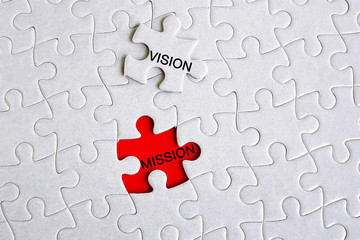 Vision and mission text on jigsaw puzzle - business concept