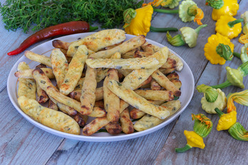potato and dough sticks and fresh young vegetables