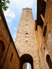 Torre Grossa, Big Tower. Bottom view from medieval streets of San Gimignano, Italy