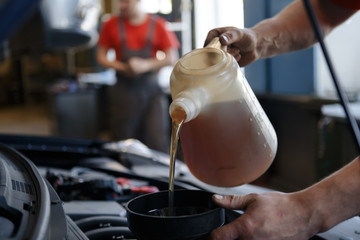 Technology and communication. Unhappy funny woman teenage girl texting on mobile phone, using smartphone reading sms on blue