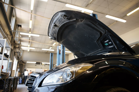 black car repair station with soft-focus in the background and over light
