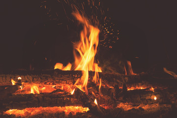 Evening bonfire with sparks close-up in the dense forests of Russia, hiking camping