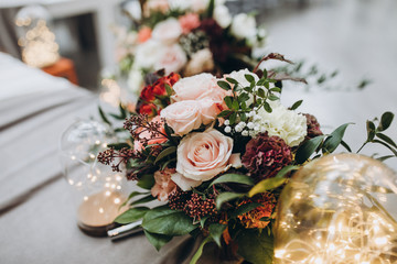banquet table is decorated with compositions of flowers and greenery
