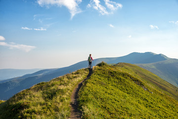 Young woman hiking in the mountains